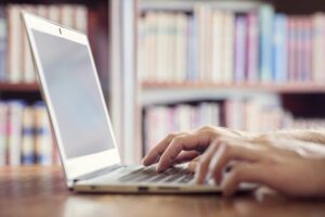 woman working on laptop in library