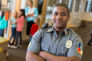 Smiling security officer in public space