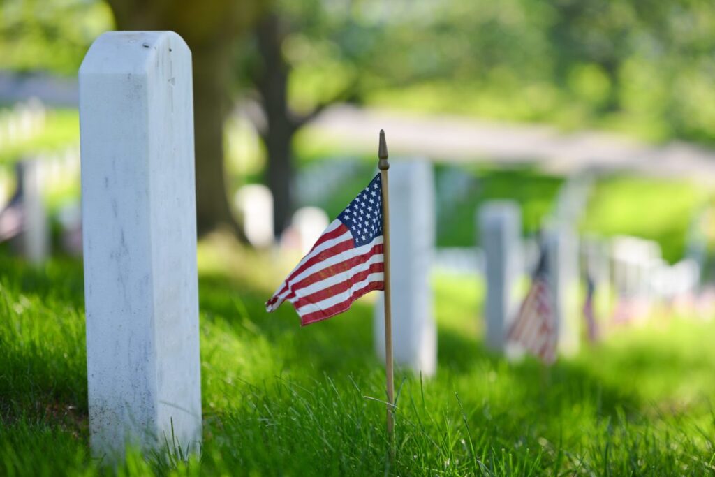 Cemetery stones with American flags