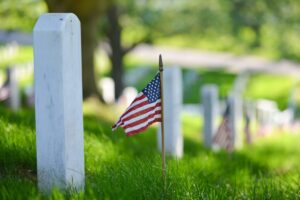 Cemetery stones with American flags