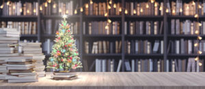 Decorated Christmas tree on Bookshelf in the library with old books