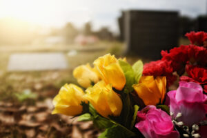 Brightly colored flowers on a grave