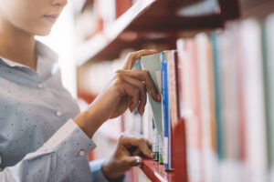 Woman choosing library book