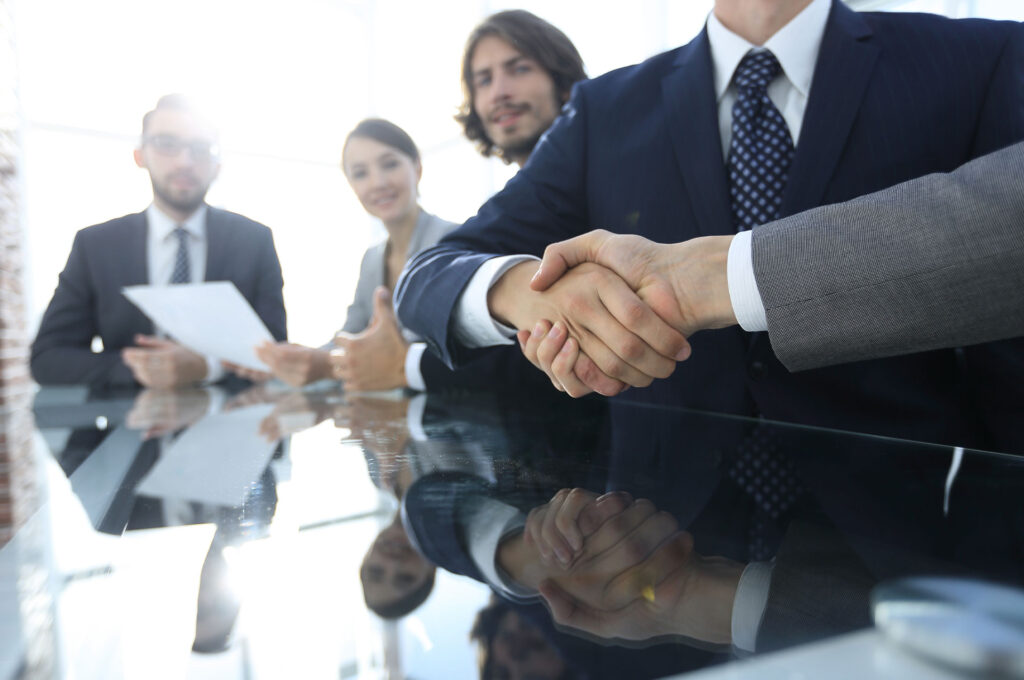 business people shaking hands professional liability